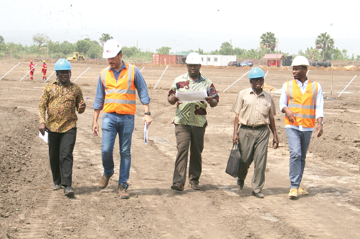 Mr Rafael Bruno Ferreira (2nd left), Production Manager, Contracta, conducting the "Daily Graphic" team round the Eastern University Project at Somanya